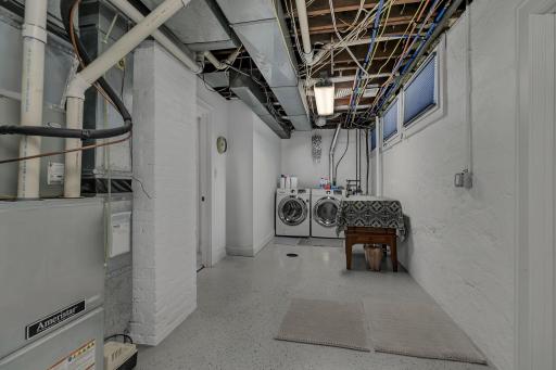 Spacious utility and laundry room offering abundant storage space and added convenience.