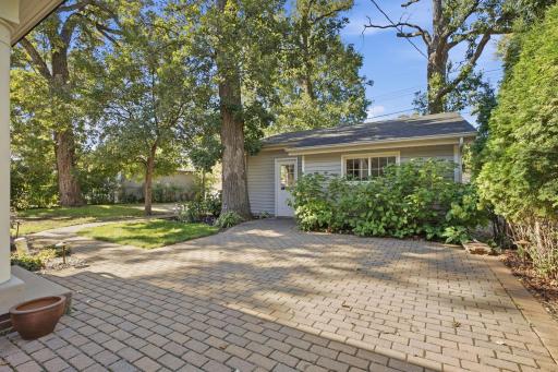 A charming backyard retreat featuring a beautiful paver stone patioâperfect for relaxing, entertaining, and enjoying the outdoors.