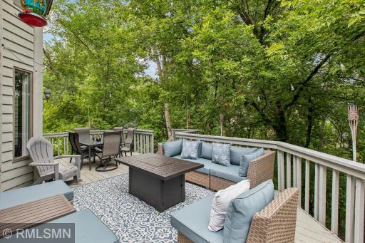 Spacious deck overlooking the private backyard