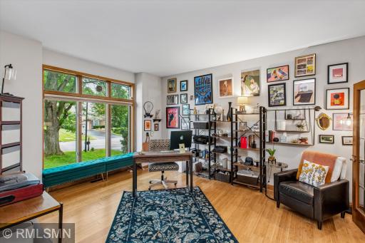 Lovely living room/office space with an abundance of natural light!