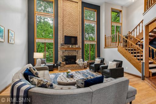 Main floor family room with floor to ceiling brick fireplace and large windows!