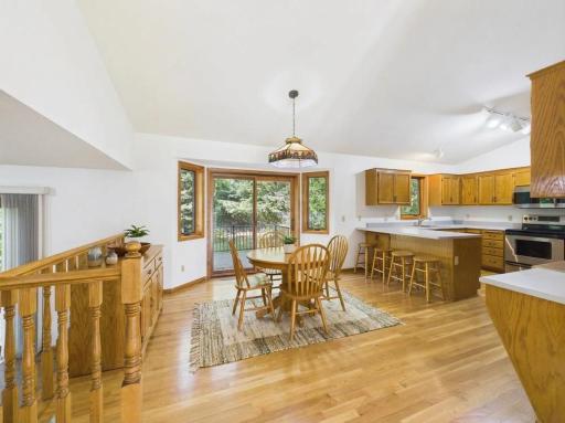 See one way the dining area could be arranged for everyday meals or hosting. Virtually staged.