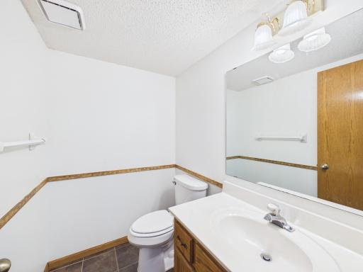 A main-level half bath adds everyday convenience.