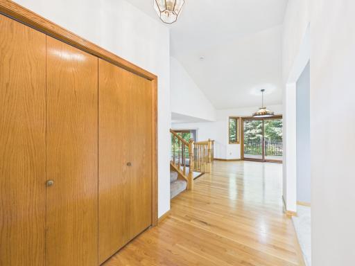 Hardwood flooring makes a warm first impression in this Chaska homeâs entry and great storage closet to boot!