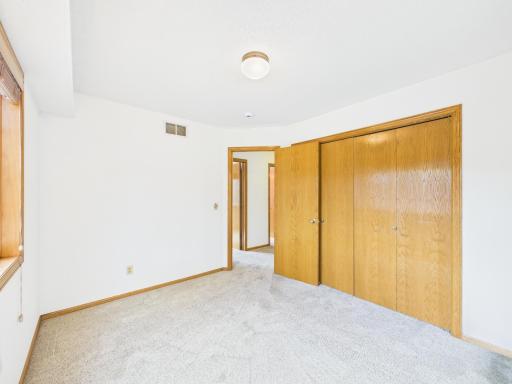 One of three upper-level secondary bedrooms, offering space for sleep, study, or guests. Bedroom 2