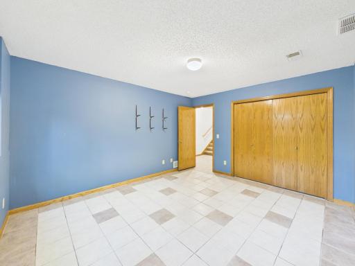A generous lower-level bedroom offers flexibility for guests, hobbies, or another use that fits your needs.