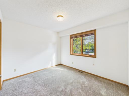 An upper-level bedroom adds useful flexibility to this five-bedroom Chaska home. Bedroom 2