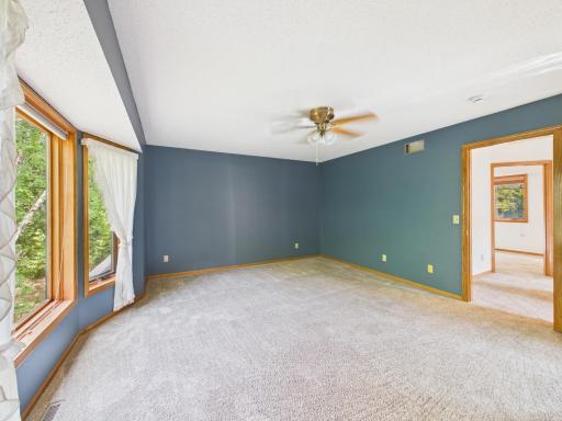 A closer look at the upper-level primary bedroom and its bay window