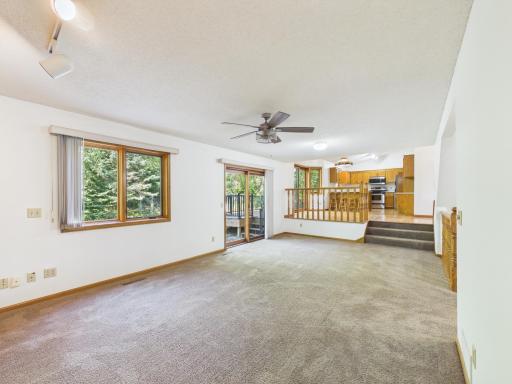 Another view of the family room with view of dining area and kitchen.