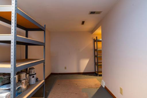 Basement has painted flooring and this room is mostly finished. Easily made into a home office.
