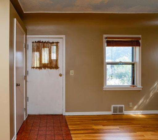 Front main entry door with coat closet and access to Living Room