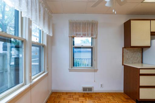 Dining area adjacent to kitchen and features south and west facing windows for lots of sunlight.