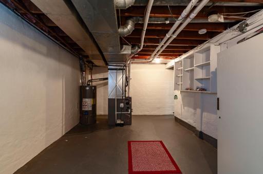 Clean and dry basement with painted walls and floors.