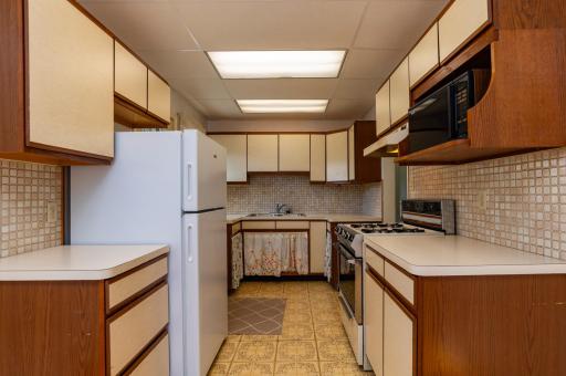 A good sized kitchen with ample cupboard and counter space.