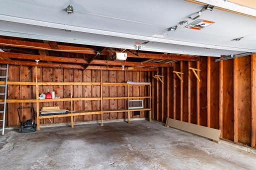Oversized double garage with built in shelving and electricity. There is enough room for a workshop.