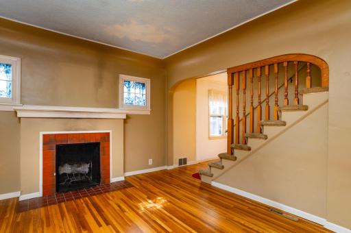 Archway and oak spindles on staircase to upper level.