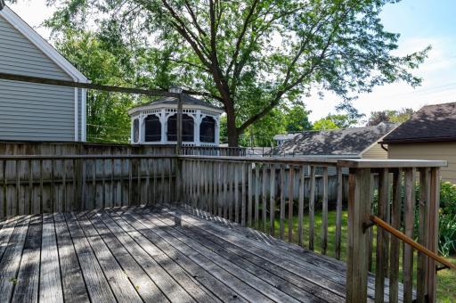 The large deck with access to fenced in backyard and garage.