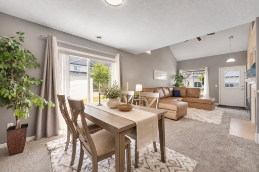Beautiful light filled dining area that walks out to the private patio. Virtually staged