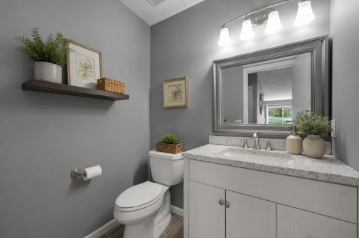 Main floor Bathroom with new vanity. Virtually Staged