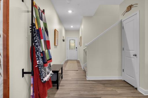 Inviting, spacious entry welcomes you with durable, stylish LVP flooring, creating a warm and modern first impression.