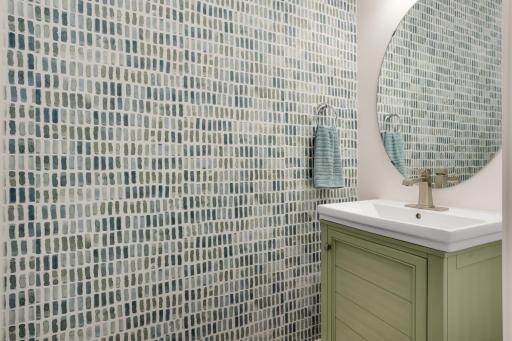 Main Floor Half Bath – Freshly updated and thoughtfully appointed, this convenient main-level powder room features a brand-new vanity, sink, and faucet, complemented by a comfort-height toilet. Clean, modern finishes add a fresh and inviting touch.