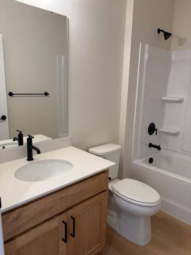 Located neatly between the two bedrooms is the shared bath featuring a full tube and shower. Model photo (Home under construction)