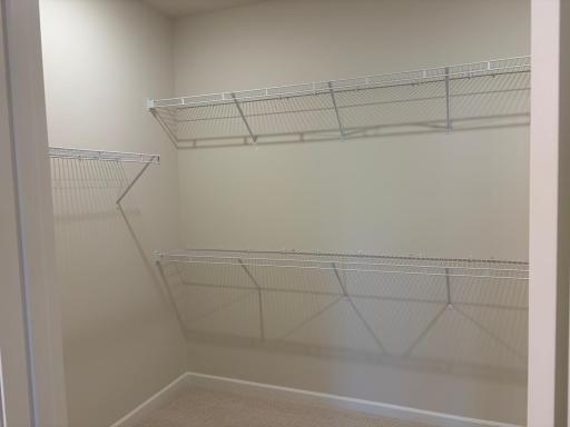 Massive walk-in closet, check! With plenty of shelving to take on even the biggest garment collections. Model photo (Home under construction)