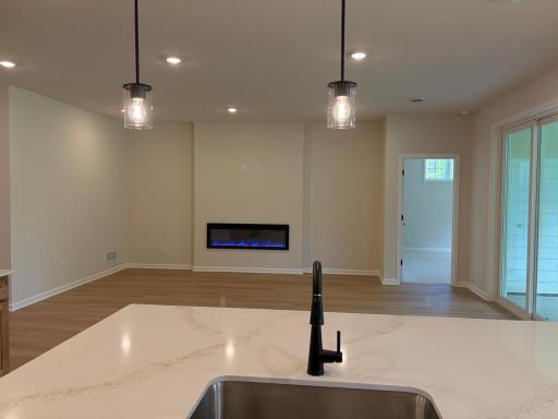 A view from the oversized island which will keep you connected with your guests while you are hosting. Model photo (Home under construction)