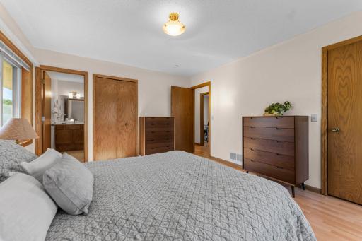 Primary suite includes its own private three-quarter bathroom.