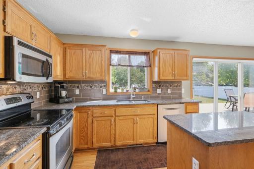 Additional kitchen angle to show the granite counters, window and mmore cabinet space.