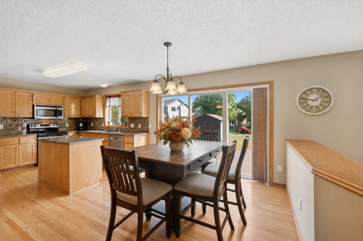 The kitchen walks out to a new maintenance free deck and flat yard with storage shed.