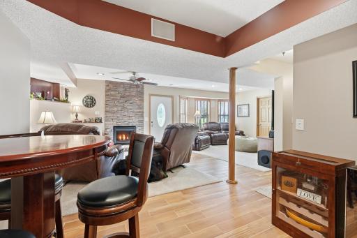 LL Family Room includes a gas Fireplace with Stone to the ceiling, a Bay Window and Walkout to a Patio!