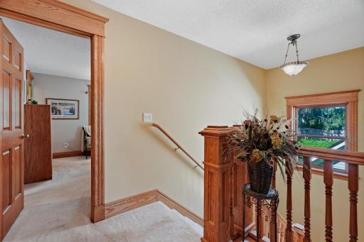 Upper Level Landing with Big Beautiful Custom Oak Trim and Banisters