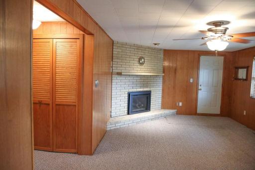 Gas Fireplace with white washed brick. Garage access from family room.