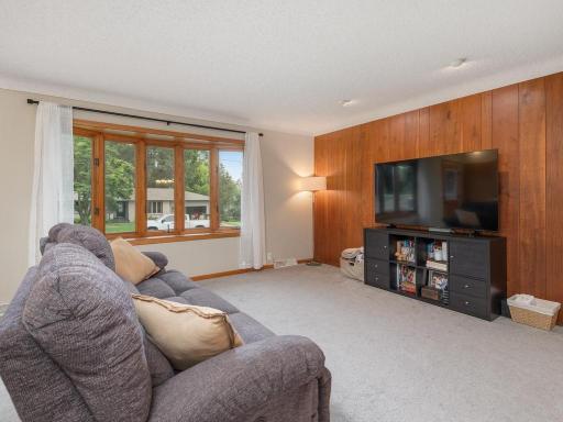 Spacious main-level living room with a large bay window.