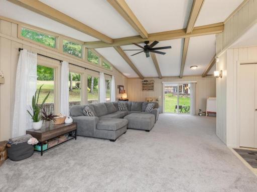 Walls of windows fill the great room with natural light and backyard views.