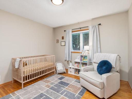 Third main-level bedroom offers hardwood floors and flexible use.
