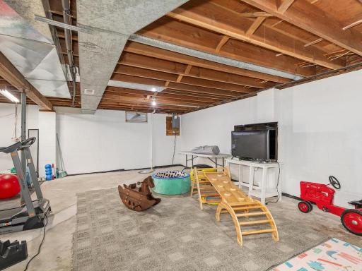 Unfinished lower level offers plenty of room for recreation, exercise, or future finishing.