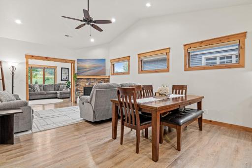 The dining area sits comfortably between the kitchen and living room.