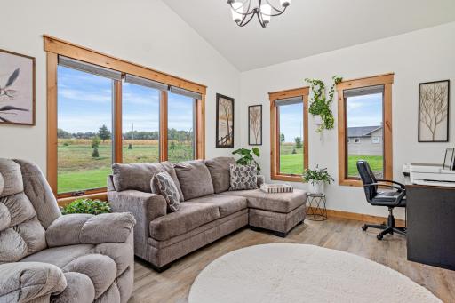 The sunroom with expansive windows featuring solar sheeting for added comfort.