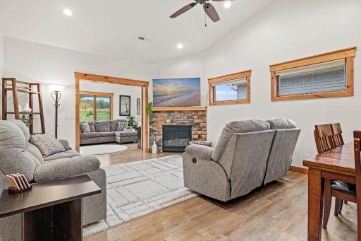 Plenty of room to gather around the stone fireplace in the living room.