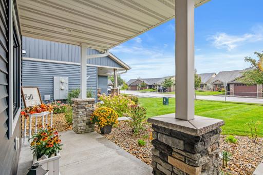 The large covered front porch adds a peaceful place to sit and enjoy the neighborhood.