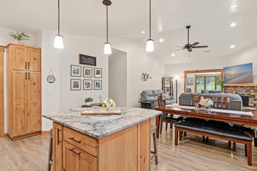 The open layout connects the kitchen, dining area, and living room.