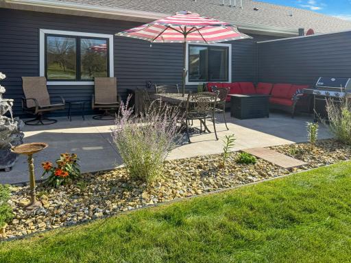 A generous patio creates plenty of space for outdoor dining, grilling, and relaxing.