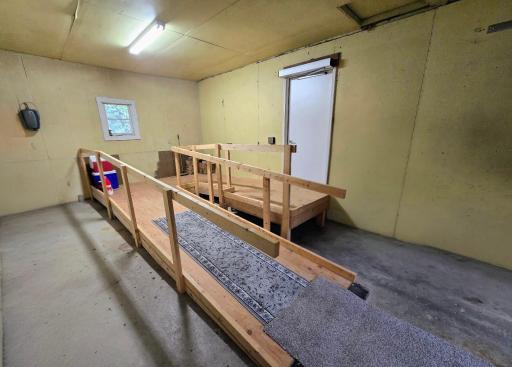 Wheelchair ramp that is in the 1st garage stall