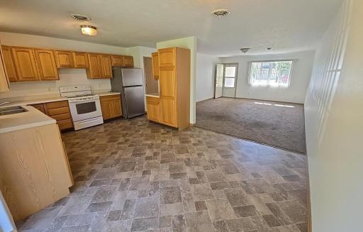You will appreciate no internal or external steps. You will appreciate the floor plan with the combined dining room and kitchen area that is open to living room.