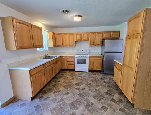Plentiful oak cabinets & countertop space.