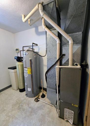Utility room provides the water softener, gas water heater 7/2019. FA gas furnace.