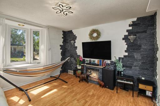 New lights, stone border, hardwood floor in living room