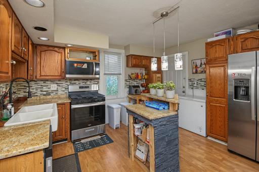 Expansive kitchen with recent update in 2023 include new stainless steel appliances and new grantie counter top